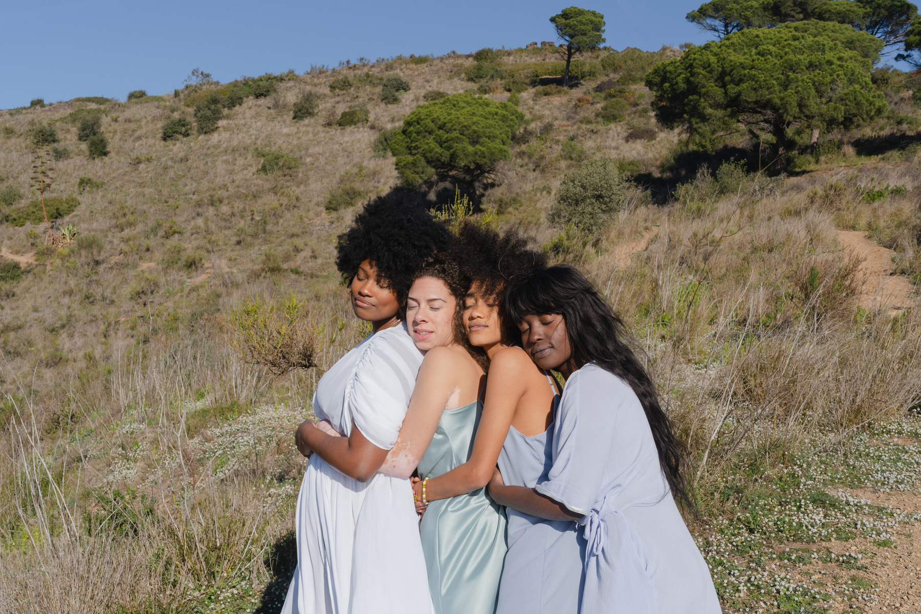 Women Hugging in the Meadow